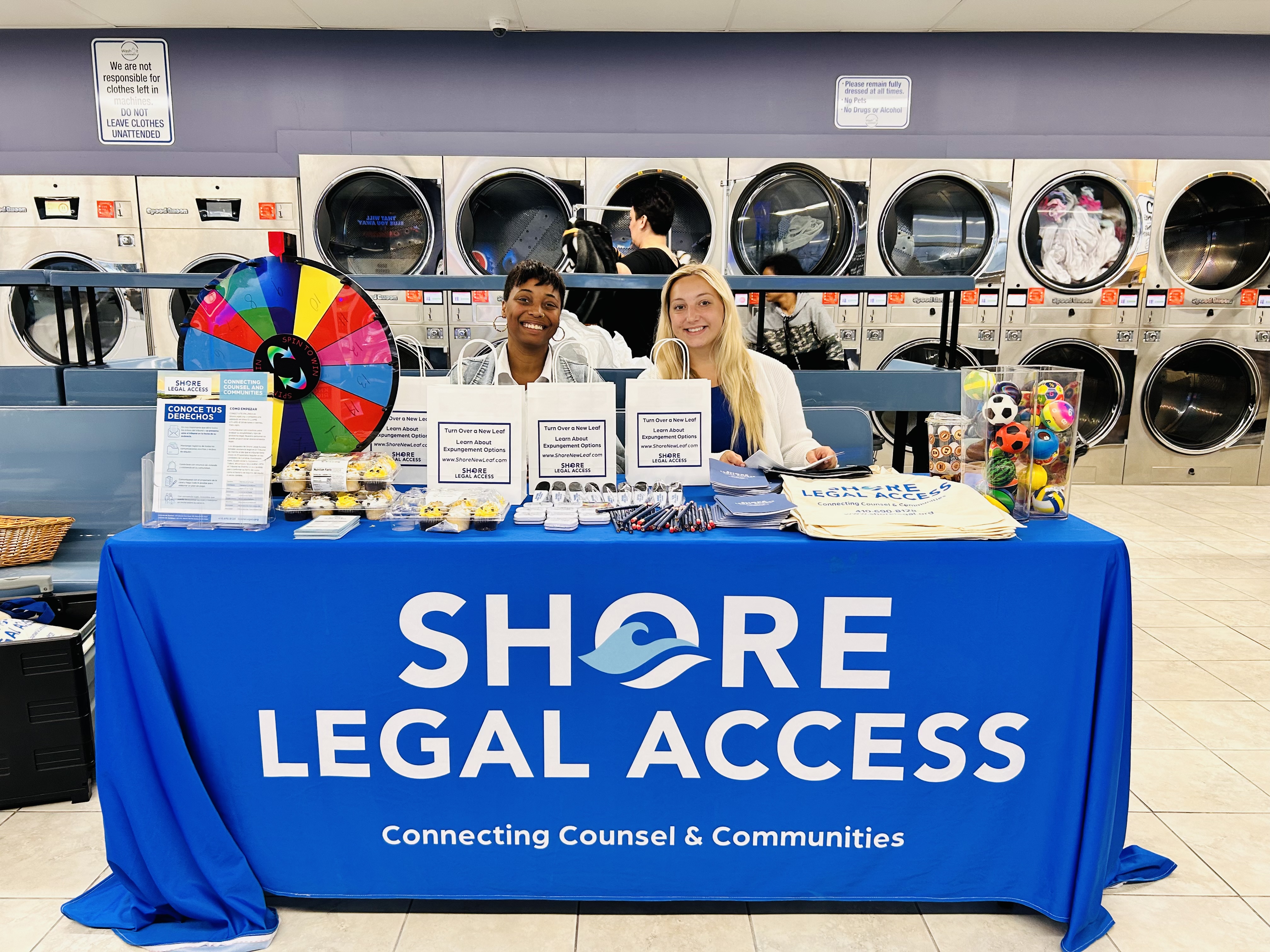 Shore Legal Access community outreach table at a Wash It event